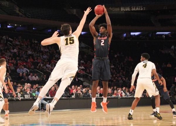 Kipper Nichols shoots over Iowa's Ryan Kriener, during the Illinois-Iowa game at the Big Ten Men's Basketball Tournament, Wednesday night in New York City