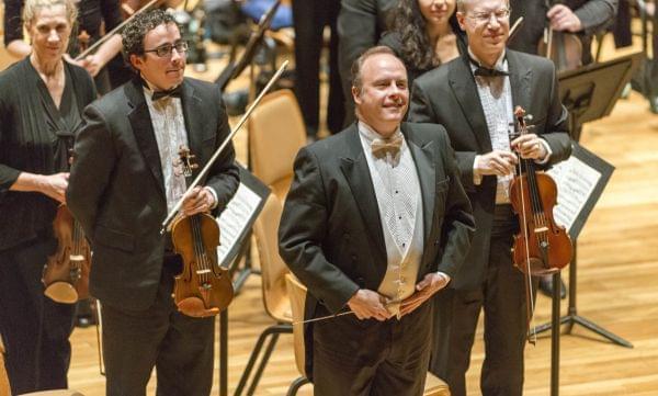 CUSO music director and conductor Stephen Alltop (second from right) on stage.