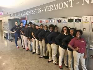 Ann Baltzer (far left) posed for a yearbook picture with her advisory students at Noble's Hansberry College Prep. 