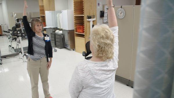 Kim Brown with physical therapist Ingrid Peele