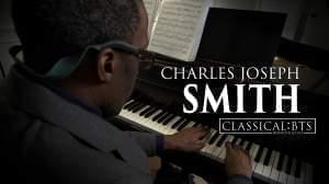 Charles Joseph Smith playing a piano