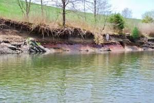 Discolored groundwater leaching into a river