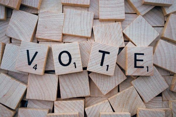 Vote spelled with tiles.