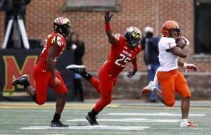 Illinois running back Reggie Corbin is chased by Maryland defensive backs Antwaine Richardson and Antoine Brooks, Jr.