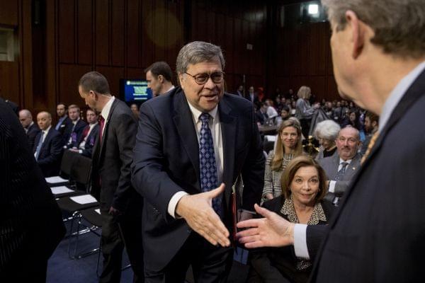 Attorney General nominee William Barr, center, shakes hands with Sen. John Kennedy, R-La., right, as he arrives to testify before the Senate Judiciary Committee on Capitol Hill in Washington, Tuesday, Jan. 15, 2019.