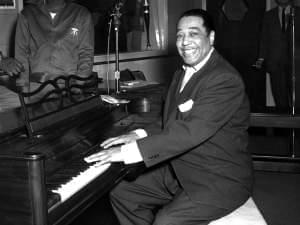 Ellington poses with his piano at the KFG Radio Studio November 3, 1954.