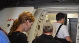 People boarding an airplane at O'Hare Airport in Chicago.