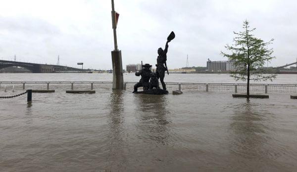 A statue of explorers Lewis and Clark is surrounded by floodwater along the St. Louis riverfront, Thursday, May 2, 3019. Several Mississippi River towns are seeing floods that are closing in on the historic levels reached in 1993.
