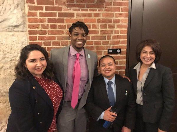 State Representatives Delia Ramirez and Elizabeth Hernandez, who sponsored the bill, flank advocates Myles Brady Davis (left) and Rowan Ewangan from Equality Illinois, who helped lobby for its passage.