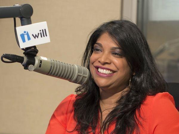 Niala Boodhoo sitting in front of a WILL microphone