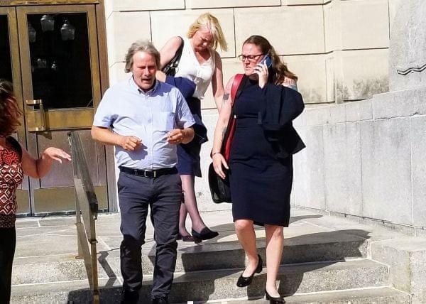 Defendant's father Mike Christensen, with defense attorneys Julie Brain and Elisabeth Pollock.