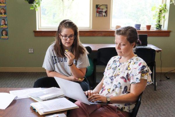 student talking to teacher