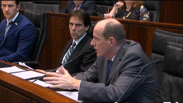 State Sen. Bill Cunningham (D, Chicago) questions a panel of university lawyers and trustees at a hearing in Chicago on Aug. 27.