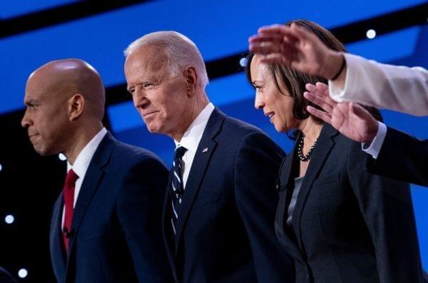 Democratic presidential hopefuls (from left): Sen. Cory Booker, D-N.J., former Vice President Joe Biden, and Sen. Kamala Harris, D-Calif., on stage before the July debate.