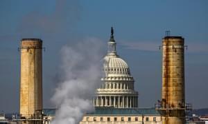  The dome of the US Capitol is seen behind the smokestacks of the Capitol Power Plant, a coal-burning plant in Washington DC.