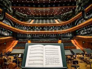 Sheets of music on stand on stage.