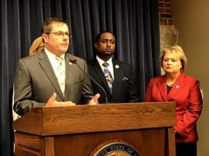 Rep. Grant Wehrli addresses the media on Oct. 28. At right, Democratic state Rep. Maurice West