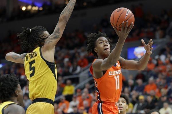 Illinois' Ayo Dosunmu heads to the basket past Missouri's Mitchell Smith.