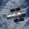 The Hubble Space Telescope orbiting above the Earth