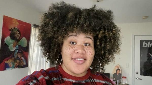 a head shot of kenya williams, a young woman in her bedroom 