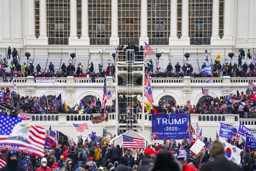 In this Jan. 6, 2021, file photo insurrectionists loyal to President Donald Trump breach the Capitol in Washington. As the number of people sentenced for crimes in the Capitol insurrection nears 200, an Associated Press analysis of sentencing data shows that some judges are divided over how to punish the rioters, particularly for the low-level misdemeanors arising from the attack.