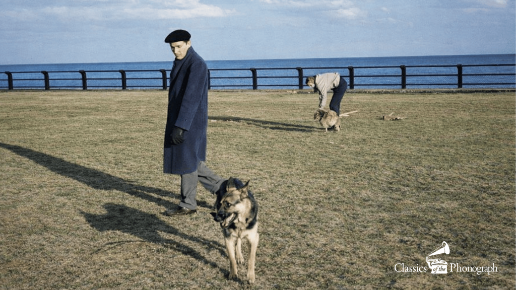 Glenn Gould by the shoreline with dogs and a friend.