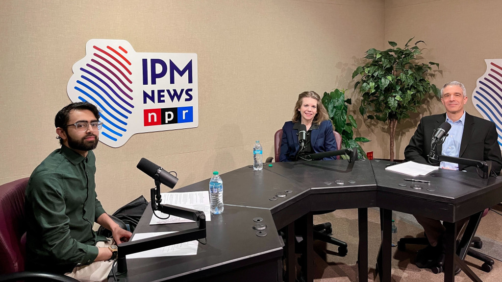 three people at podcast studio