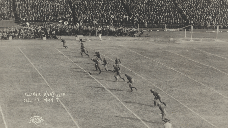 football players lined up from one side of field to the other ready to kick off