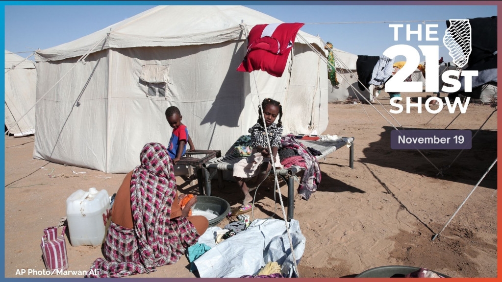 A Sudanese woman displaced from El-Fasher washes clothes outside her family's tent as children sit nearby at the newly established El-Afadh camp in Al Dabbah, in Sudan's Northern State, Sunday, Nov. 16, 2025. 