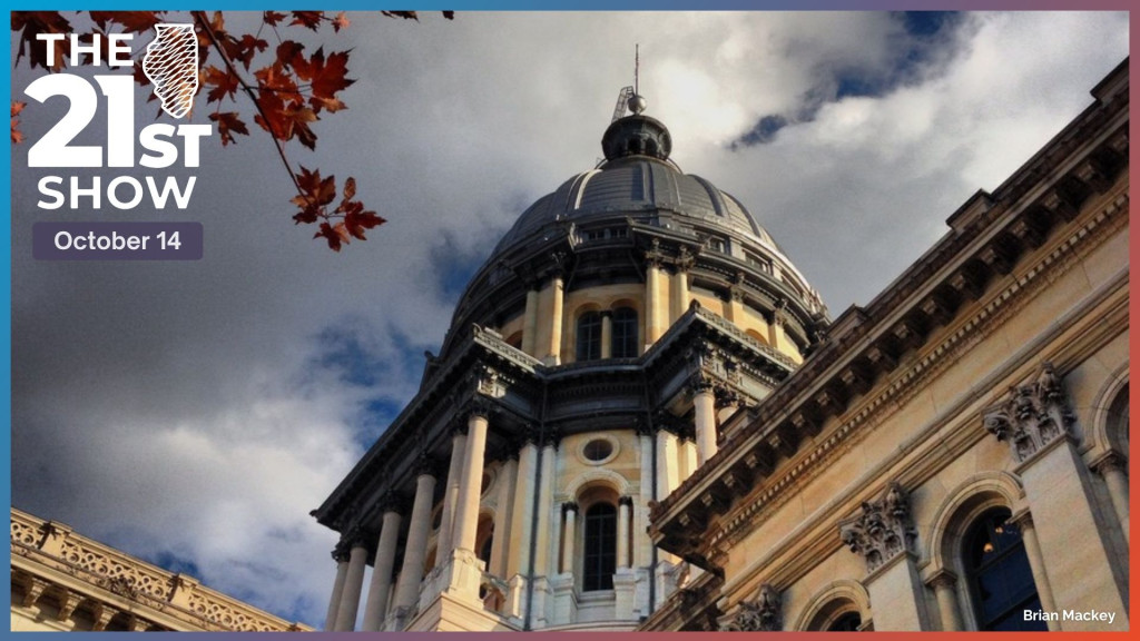 fall foliage frames a view of the silver dome and sandstone walls of the Illinois State Capitol Building