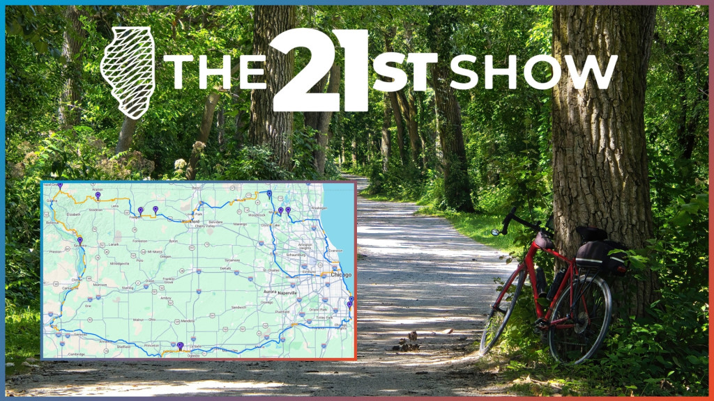 next to a paved bike path, a red bicycle leans against a tree in a lush forest