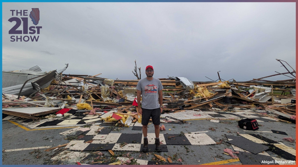 A photograph of Michael Yager, president and CEO of Mid America Motorworks, a manufacturer of parts for classic Corvettes and Volkswagens. He stands in the wreckage of his business after tornadoes tore through the area. 