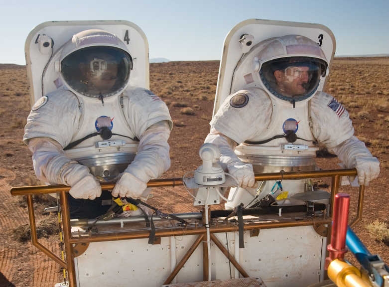 A simulation of two astronauts walking on Mars.