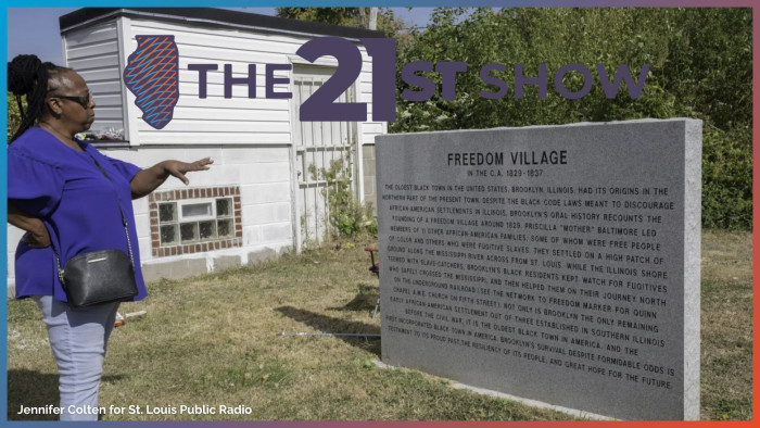 Roberta Rogers looks at a monument at Quinn Chapel AME Church marking Brooklyn, Illinois, as a historic freedom village and honoring founder Pricilla 