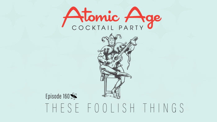 Atomic Age logo with an illustration of a court jester holidn a guitar.