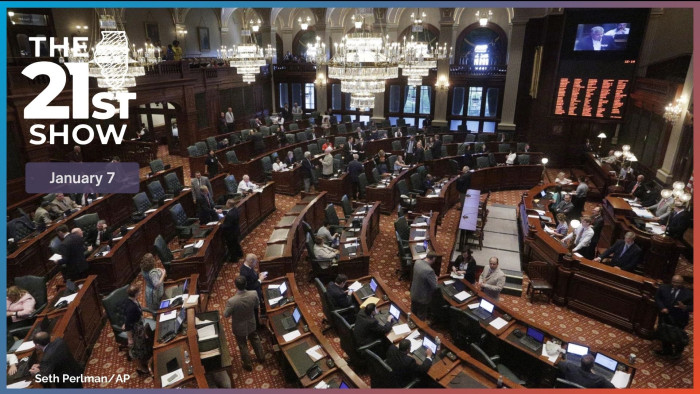 Illinois lawmakers listen to debate on the House floor during a session at the Illinois State Capitol.