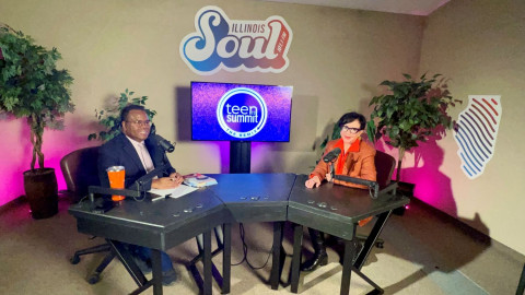 two people at podcast desk