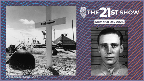 A world war 2 military helmet on a sandy beach next to a white cross marking a grave. The cross is labeled 