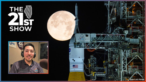 the white light of a full moon shines behind the white capsule atop an orange rocket, which is connected to a huge launch rig filled with pipes and wires; in the inset photo a man with dark hair wears a navy blue polo shirt with the Artemis logo on the right chest